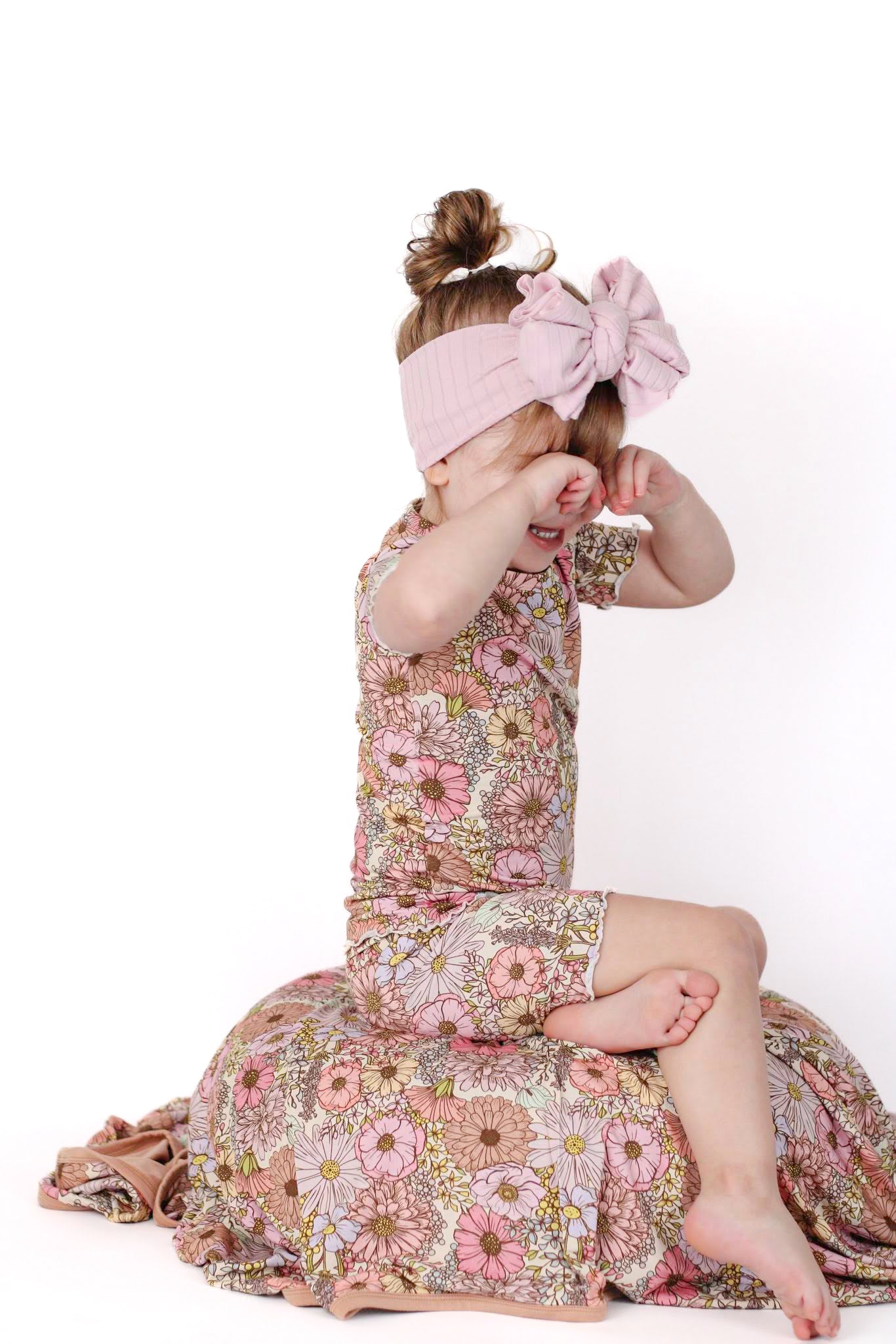 Toddler girl wearing floral bamboo pajamas.