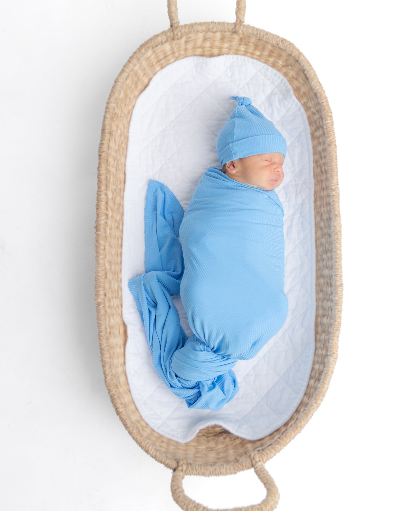 Soft blue ribbed bamboo swaddle for newborns, made from eco-friendly and breathable bamboo fabric for ultimate comfort.