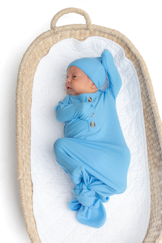Soft blue ribbed bamboo knotted gown and hat set for newborns, made from eco-friendly and breathable bamboo fabric for ultimate comfort.