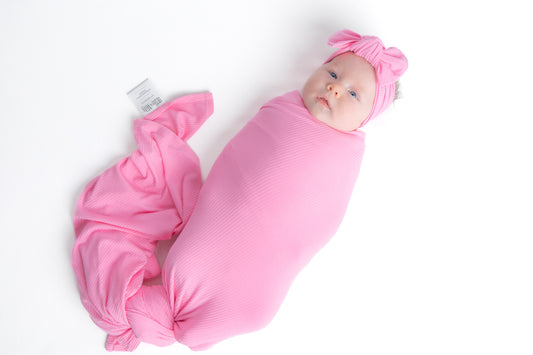 Pink newborn swaddle blanket.