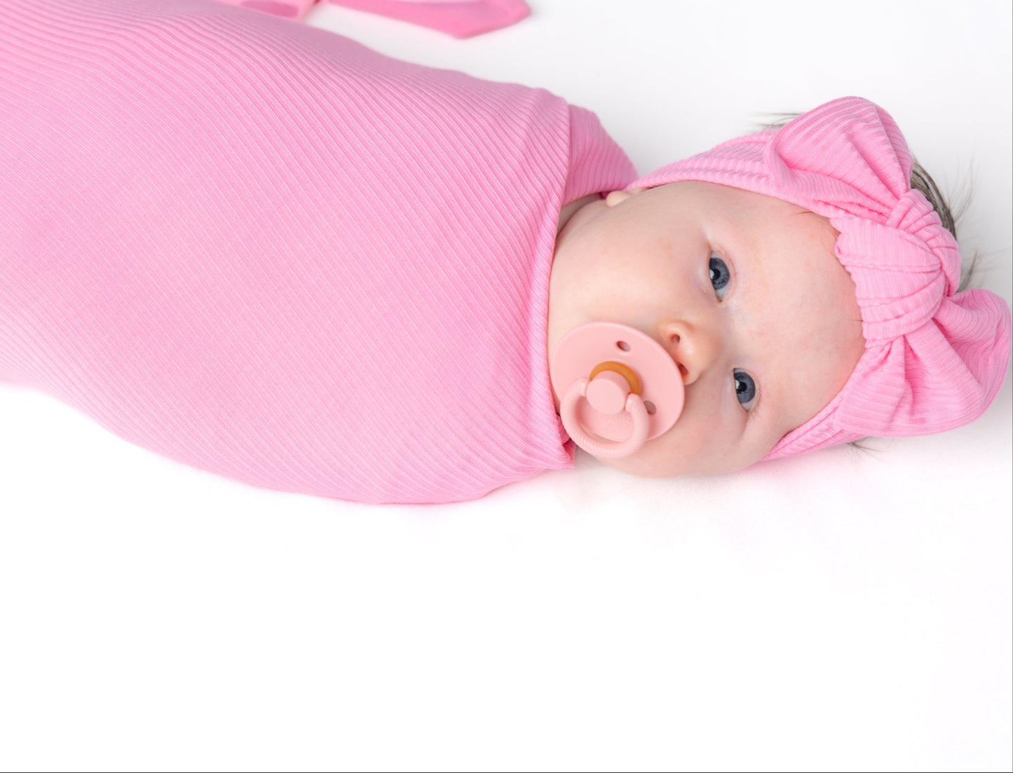 Pink bamboo swaddle blanket for baby.