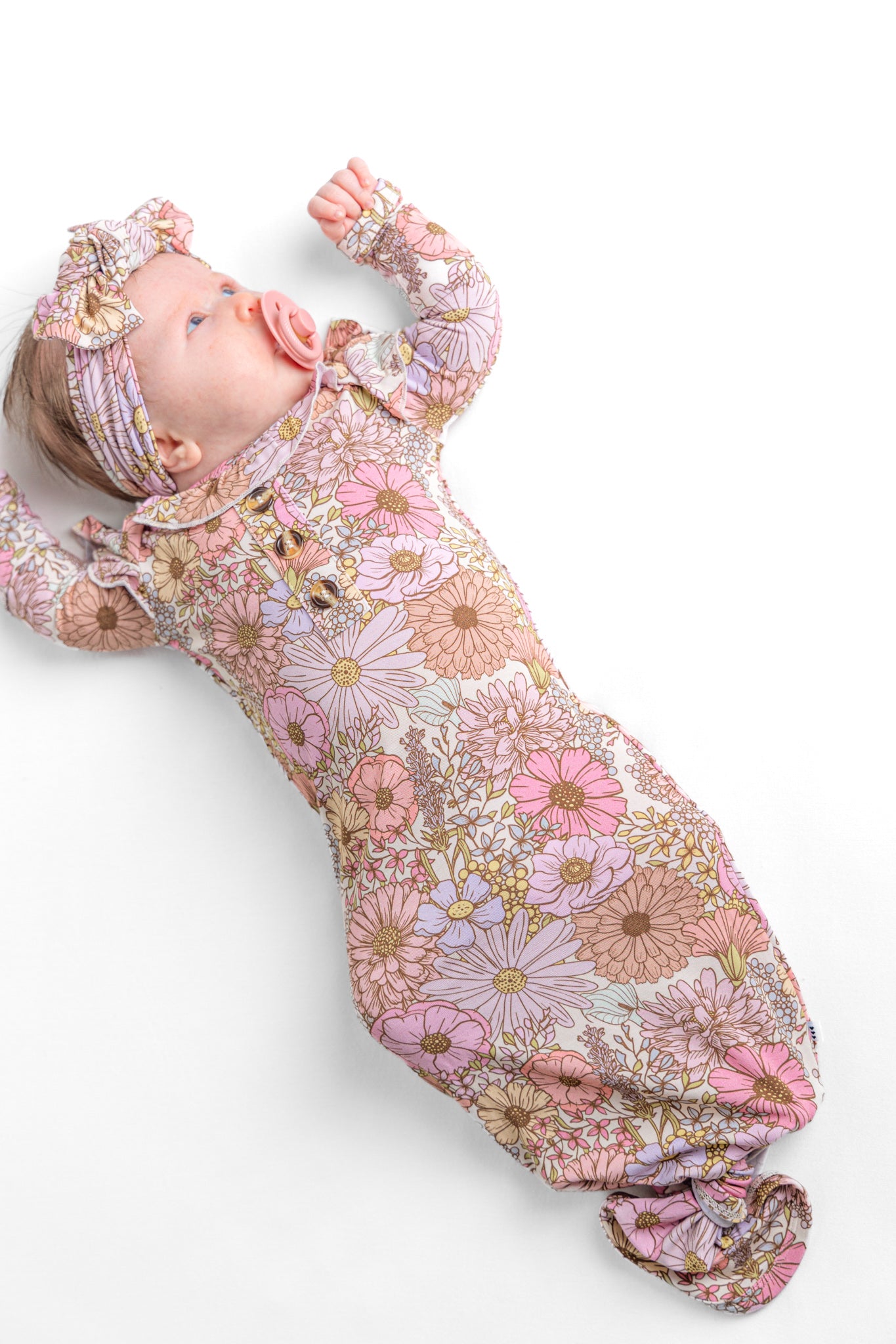Floral newborn bamboo knotted gown and bow set.