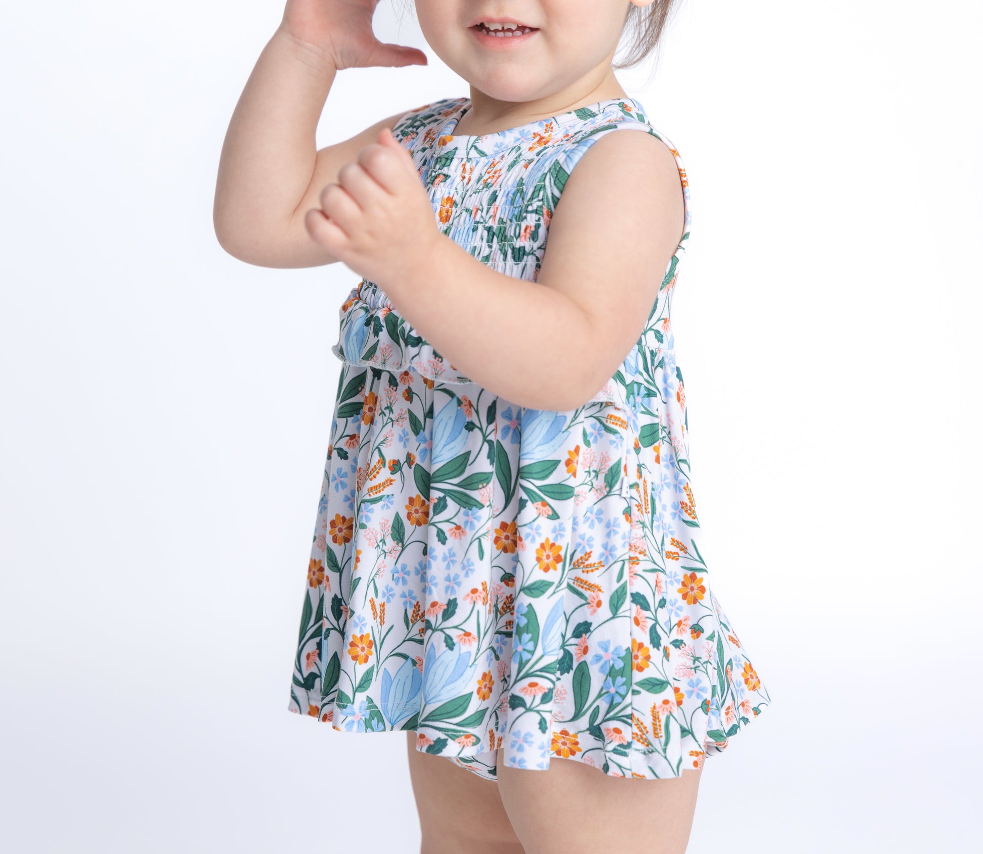 Shop our bamboo smocked onesie dress in a blue and pink spring floral print. Eco-friendly and breathable for all-day comfort.
