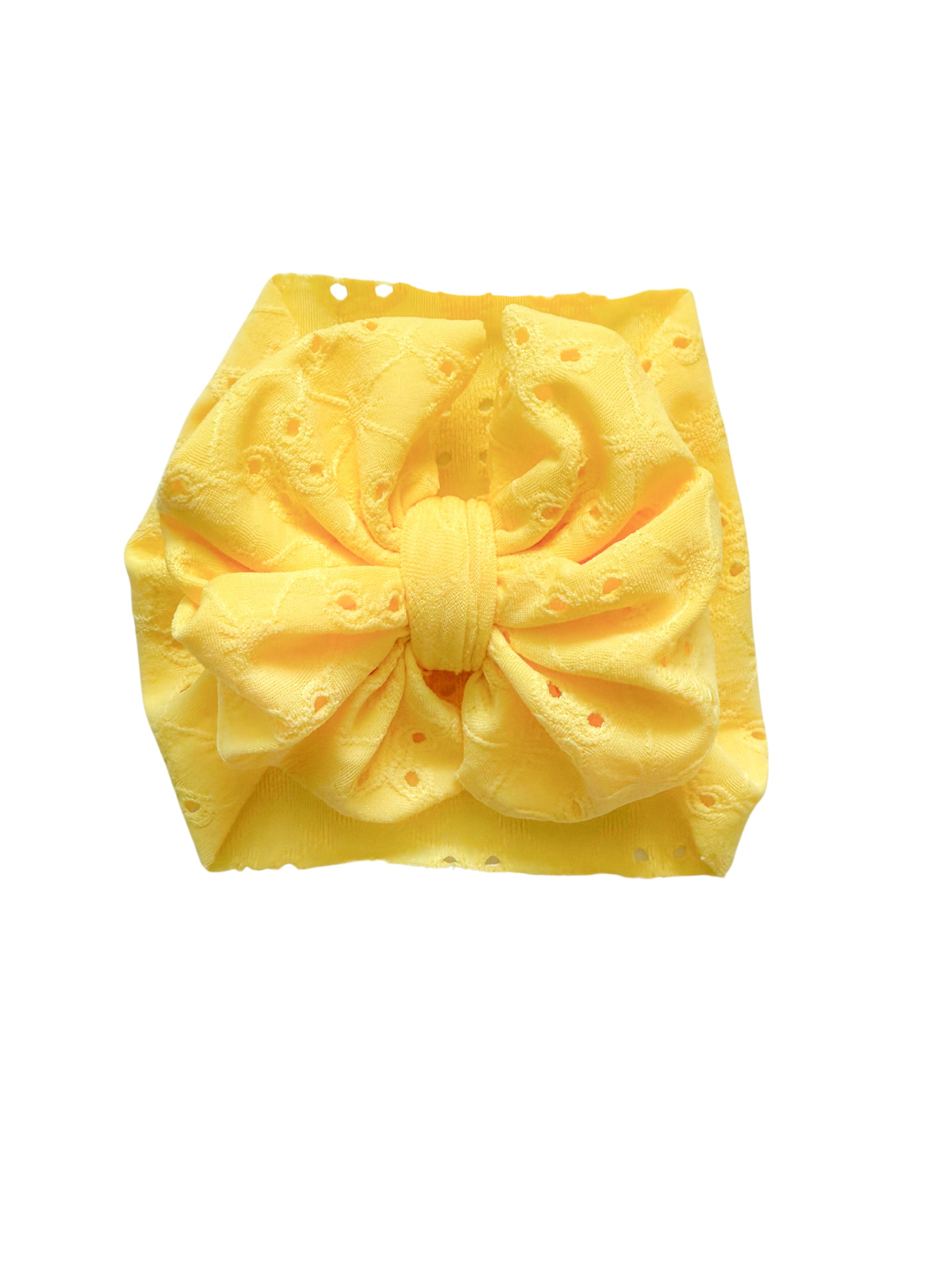 Yellow eyelet headwrap bow for baby girl.