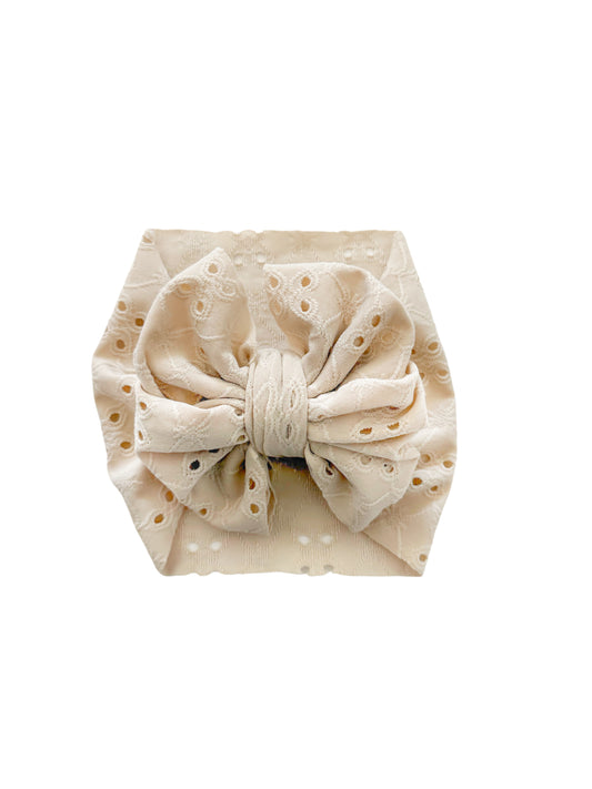 Beige Eyelet headwrap bow for newborn and toddler. 