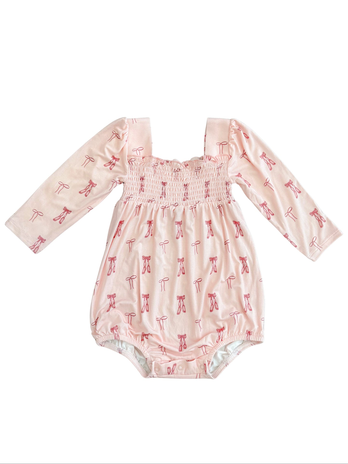 Smocked bubble romper for baby girl featuring print with ballet shoes and bows. 