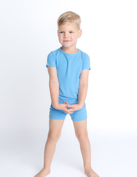 Blue ribbed bamboo pajama set for toddlers and kids, made with soft, breathable, and eco-friendly fabric for a comfortable night's sleep. Shop now!