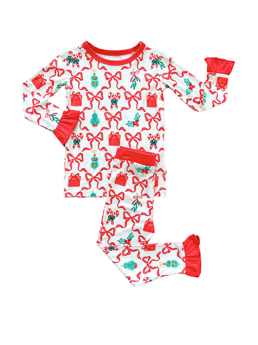 Cozy two-piece bamboo set with ruffle cuffs featuring a festive Christmas print of bows and candy canes.