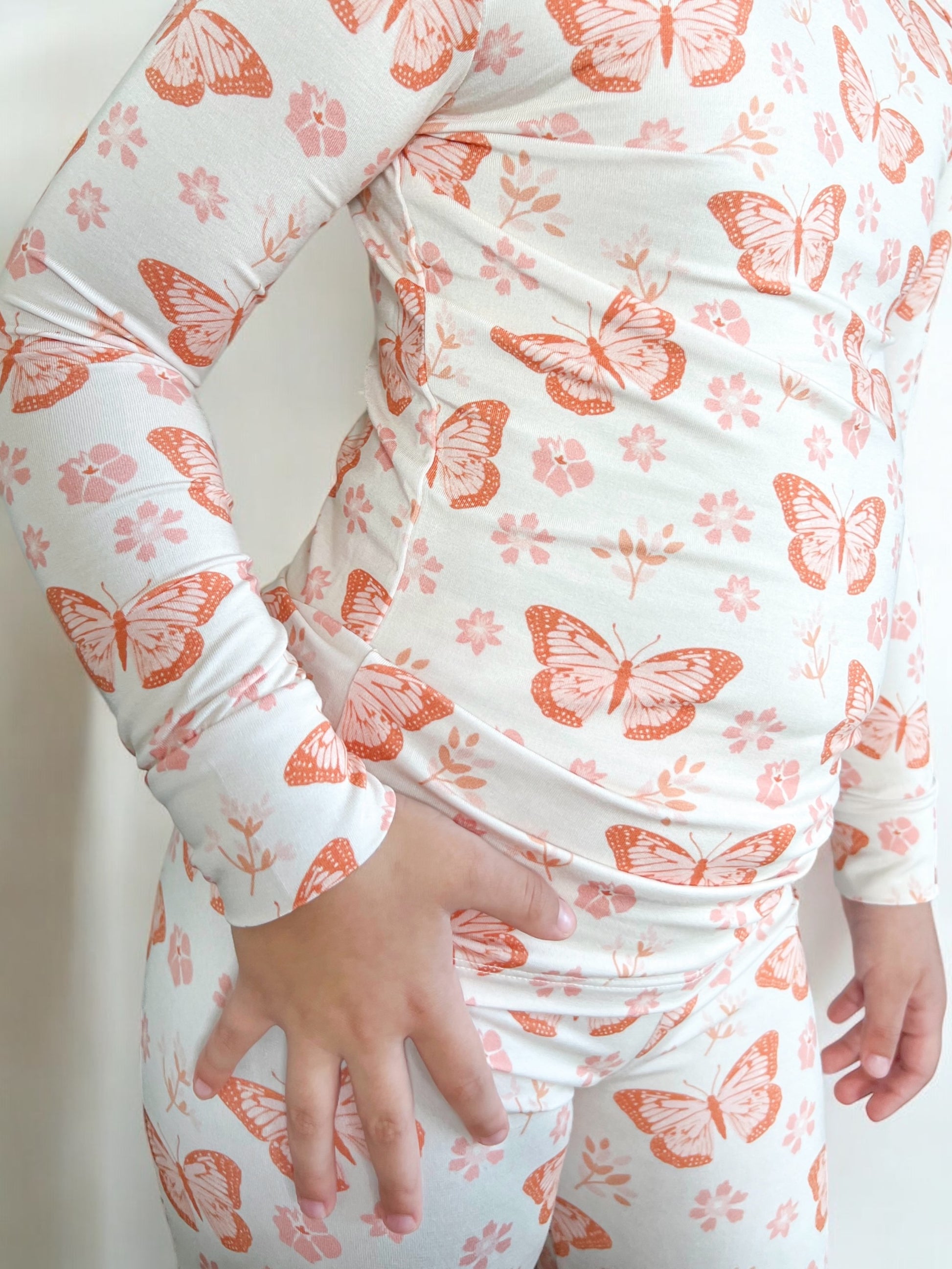 Bamboo two piece pajamas for toddlers and kids featuring a dainty butterfly and floral print. Cozy up in style!