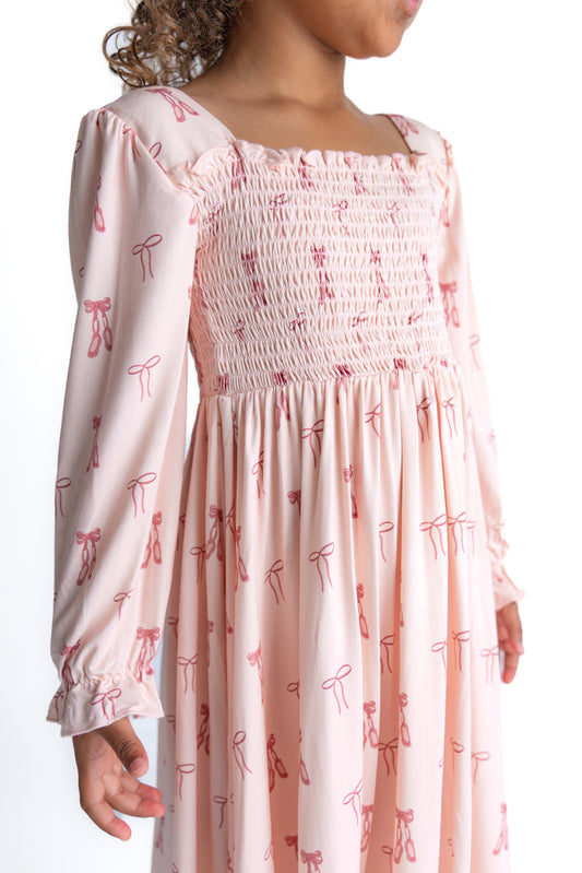 Girl wearing a pink ballet bamboo twirl dress