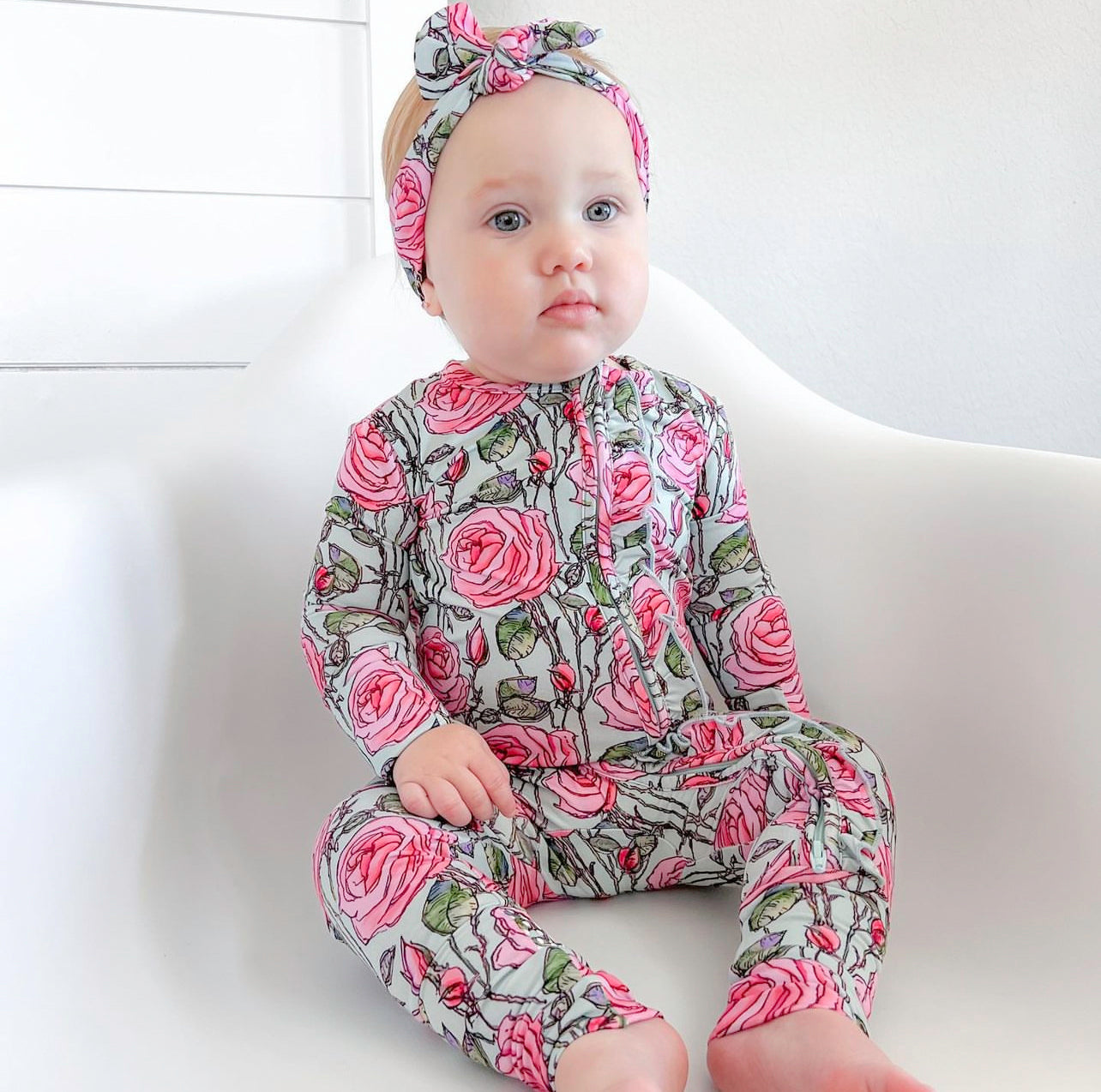 bamboo convertible zip romper for baby with pink roses and ruffles.