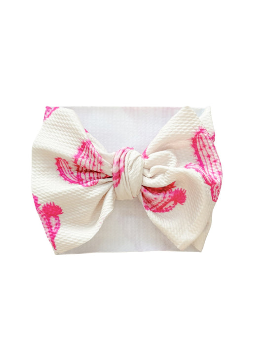 Baby headwrap bow with pink cactus print.