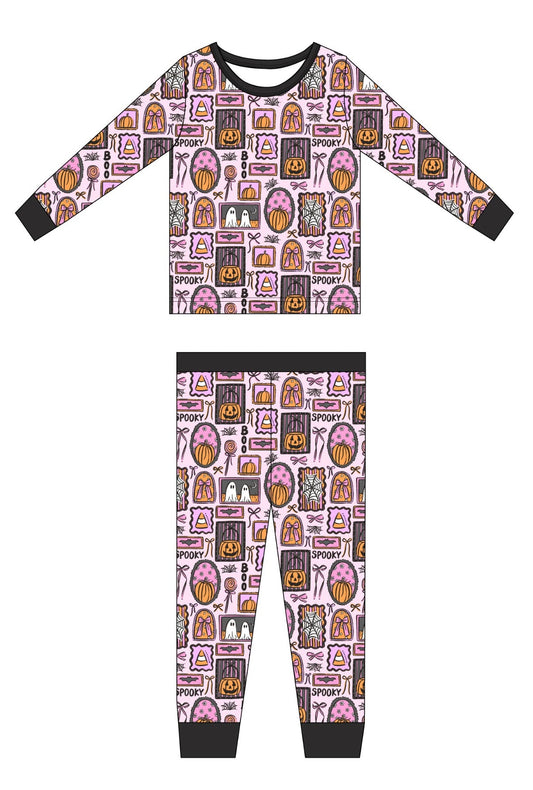 Children's pajama set with Halloween-themed pattern on a white background