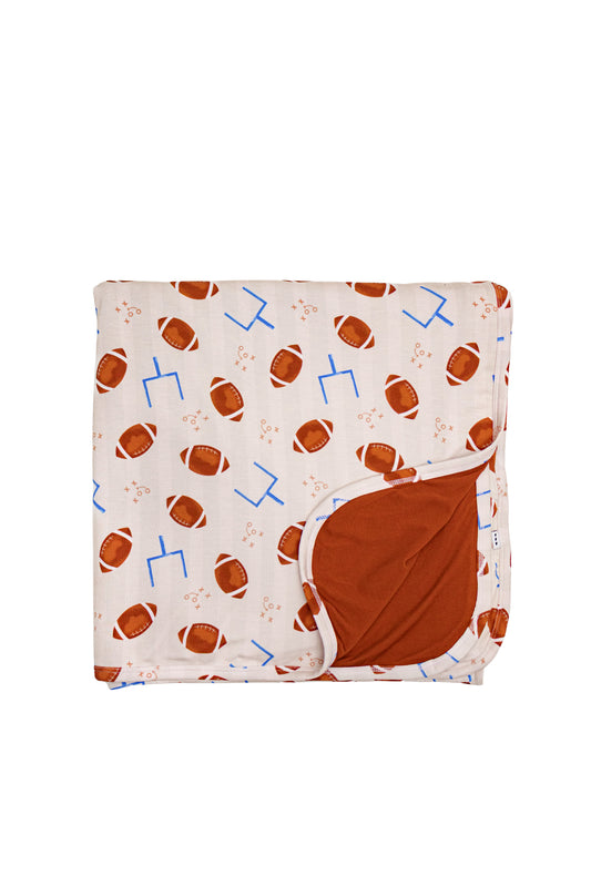 Elle & Mily bamboo baby blanket with football print and rust trim