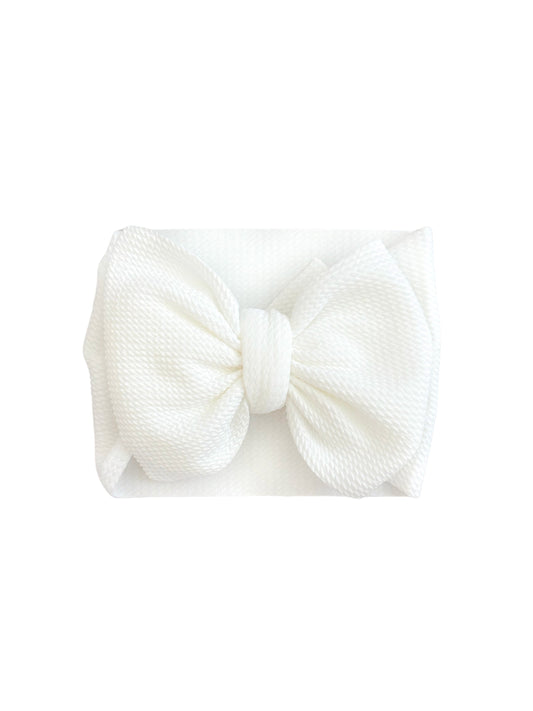 White bow headband on a white background